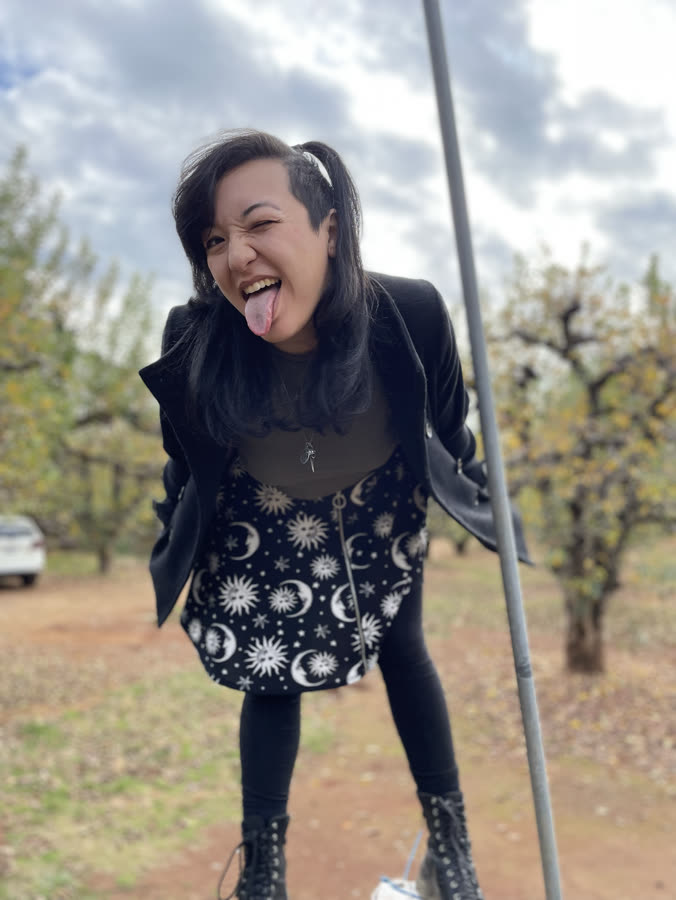 A playful portrait in a blossoming orchard