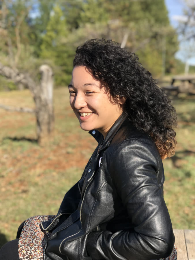 Backlit profile portrait in a leather jacket