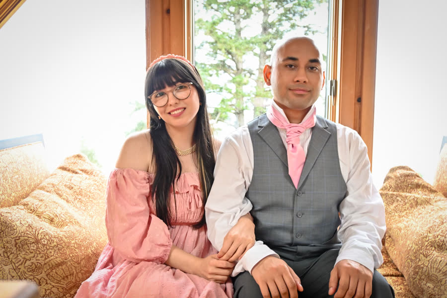 A couple seated together in soft daylight