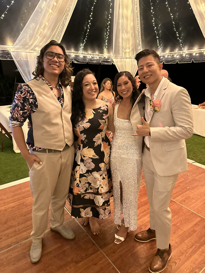 Wedding guests under string lights at the reception